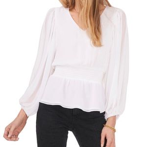 COPY - Sheer, flowy sleeves lend an ethereal quality to this lovely blouse..